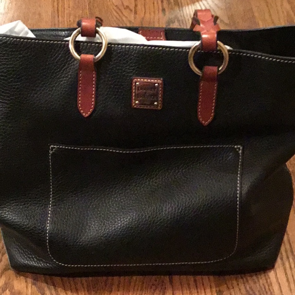 Black Pebble leather with amazing pockets.  Brown braid straps.